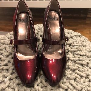 Patent leather burgundy pumps.